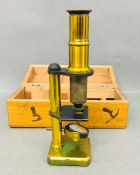 A Brass microscope in wooden case