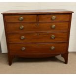 A two over three chest of drawers with brass embossed handles (H104cm W120cm D54cm)