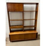 A G-Plan wall unit, open shelves with small double door cupboard to top right and cupboard under (