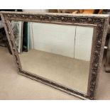 A wall mirror with carved edge (H112cm W138cm)