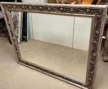 A wall mirror with carved edge (H112cm W138cm)