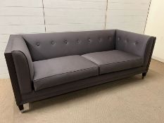 A sleek contemporary square button back sofa, part of a Linley bespoke design project (H73cm