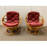 A pair of cane rattan swivel chairs by Angraves Thurmaston circular bucket shape Mid Century