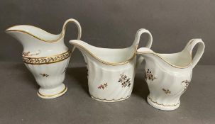 A selection of three fluted 18th century porcelain milk jugs