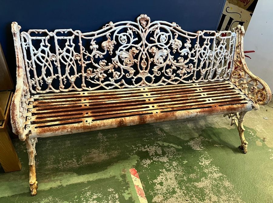An architectural cast iron bench with vine pattern cast back, scrolling arms and iron slat seats, - Image 9 of 18