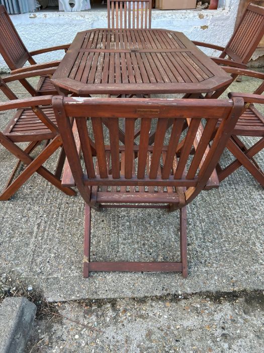 A six seater wooden garden table with folding chairs (H74cm W150cm D87cm) - Image 2 of 7