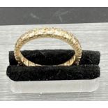 A 9ct gold eternity ring, size N (1.9g)