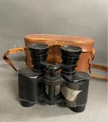 A pair of military binoculars made in France in leather case.