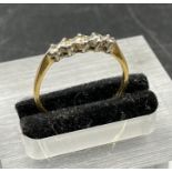 An 18ct yellow gold, five stone diamond ring (Total Weight 1.8g)