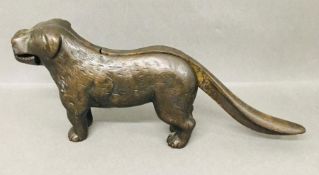 A Cast iron nutcracker in the form of a dog.