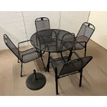 A garden Kettler table and chairs, mesh style with flower cartouche to top