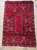 A red rug with square to centre 100cm x 150cm