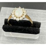 An Opal and diamond 9ct gold ring,N1/2 (1.8g)