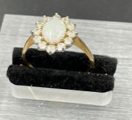 An Opal and diamond 9ct gold ring,N1/2 (1.8g)