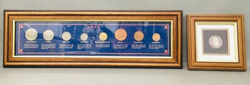 Two framed coin sets, an enamelled penny and the Sterling coin collection.