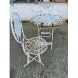 A white metal oval table, bistro set with two chairs