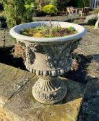 A pair of Bacchus relief garden urns