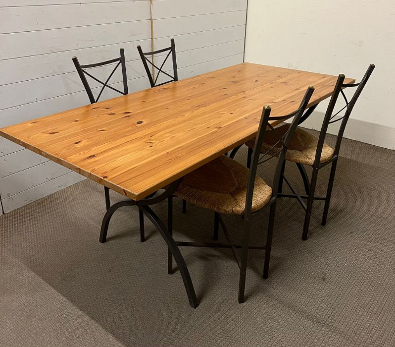 A pine dining table on metal legs and four chairs (180cm x 78cm x 72cm) - Image 2 of 4