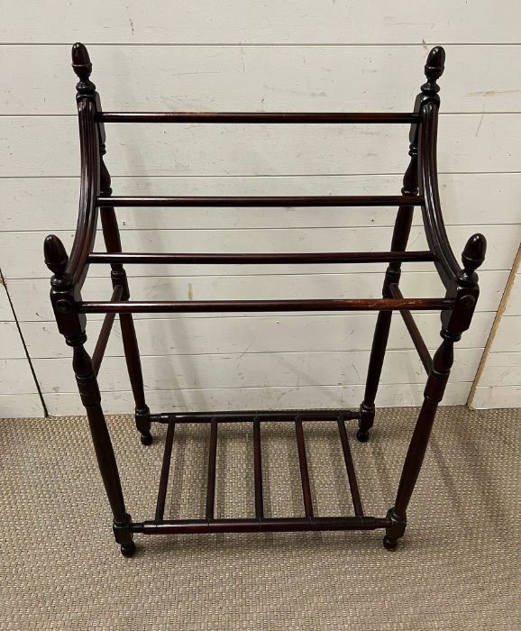 A Victorian mahogany clothes rail on turned supports