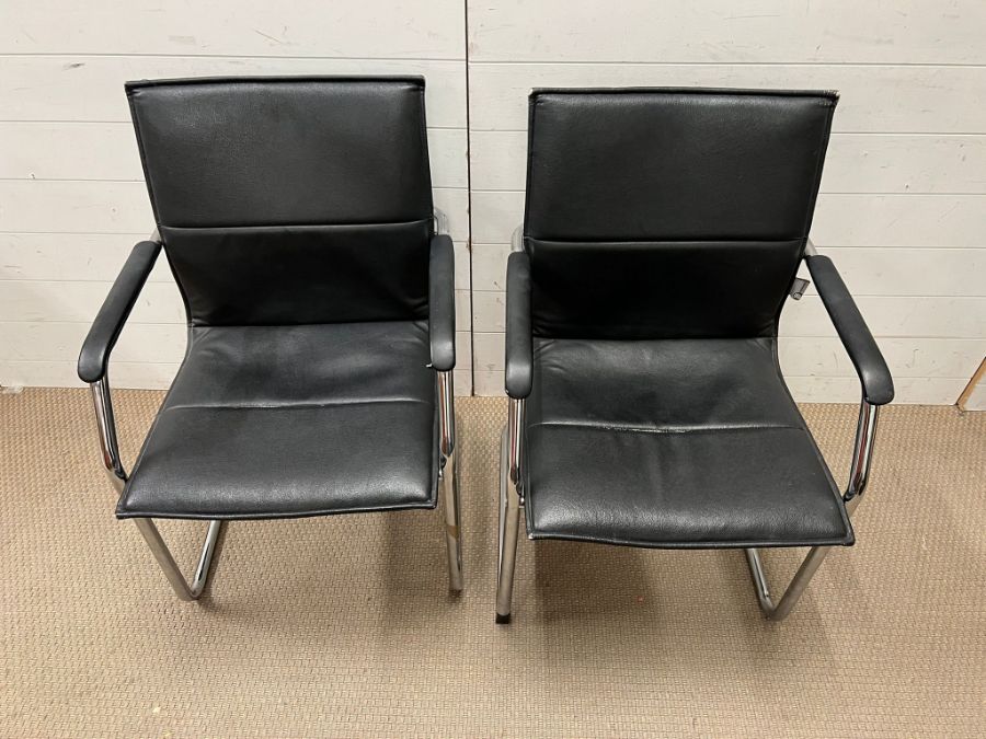 Two tubular frame office chairs