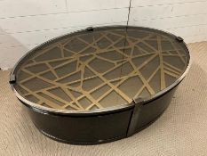 An oval contemporary coffee table, possibly Eichholtz (H40cm W120cm D80cm)