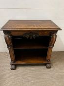 An oak side cabinet with scrolls to side and turned scroll legs (H61cm W60cm D33cm)