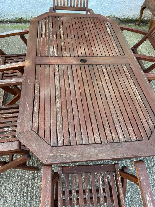 A six seater wooden garden table with folding chairs (H74cm W150cm D87cm) - Image 3 of 7