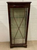 A mahogany display cabinet