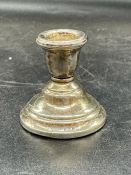 A single silver squat candlestick, hallmarked for Birmingham 1924