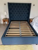 A blue button back headboard (4ft 6)