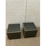 Two smoked mirrored glass formal side tables with chrome edging on a wooden rosewood style base (