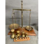 A set of Antique weigh scales by M A Webb of London with assorted weights up to 7lb.