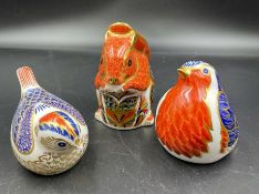 Three Crown Derby figures with gold buttons, squirrel, and two birds.