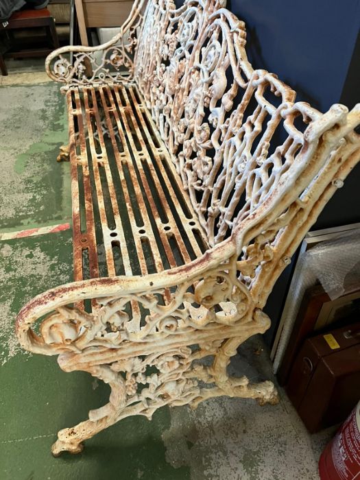 An architectural cast iron bench with vine pattern cast back, scrolling arms and iron slat seats, - Image 8 of 18