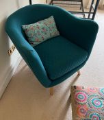 A teal chair on teak style legs and foot stool