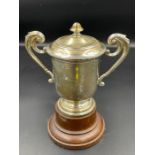 A silver lidded trophy on stand, hallmarked for Birmingham 1911, total weight 136g