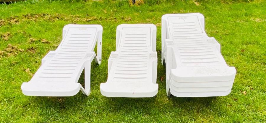 Six plastic garden loungers