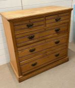 A pine two over three chest of drawers (H108cm W106cm D52cm)