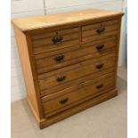 A pine two over three chest of drawers (H108cm W106cm D52cm)