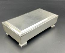 A silver cigarette box, by Adie Brothers Ltd, hallmarked for Birmingham 1962