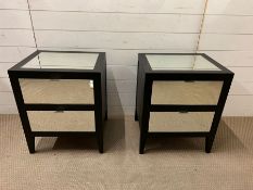 A pair of black lacquered and mirrored bedside cabinet