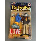 A Beatles Yellow Submarine figure 'Paul' in original packaging.