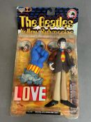 A Beatles Yellow Submarine figure 'Paul' in original packaging.