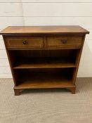 A stain wood side cabinet with open shelves and two drawers above (H78cm W76cm D47cm)