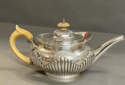 A Robert Harper silver teapot, engraved with the armorial Brackenbury, hallmarked for London 1879 (