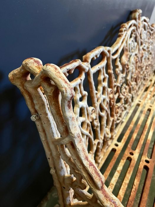 An architectural cast iron bench with vine pattern cast back, scrolling arms and iron slat seats, - Image 5 of 18