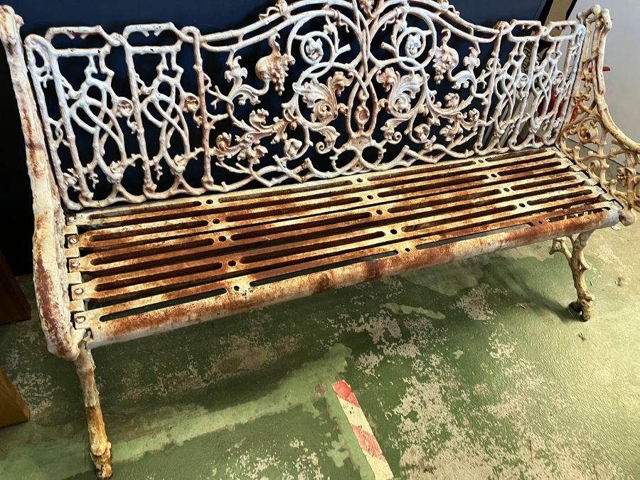 An architectural cast iron bench with vine pattern cast back, scrolling arms and iron slat seats, - Image 6 of 18