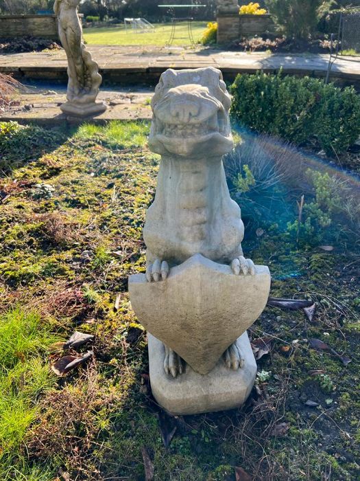 A garden gargoyle or mythical beast holding a shield (H74cm Base Sq27cm)