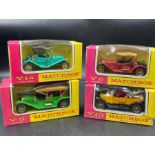 A selection of four Matchbox Models of Yesteryear diecast vehicles.
