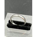 A Platinum 4mm wedding ring, engraved with date. 5g (Size L)